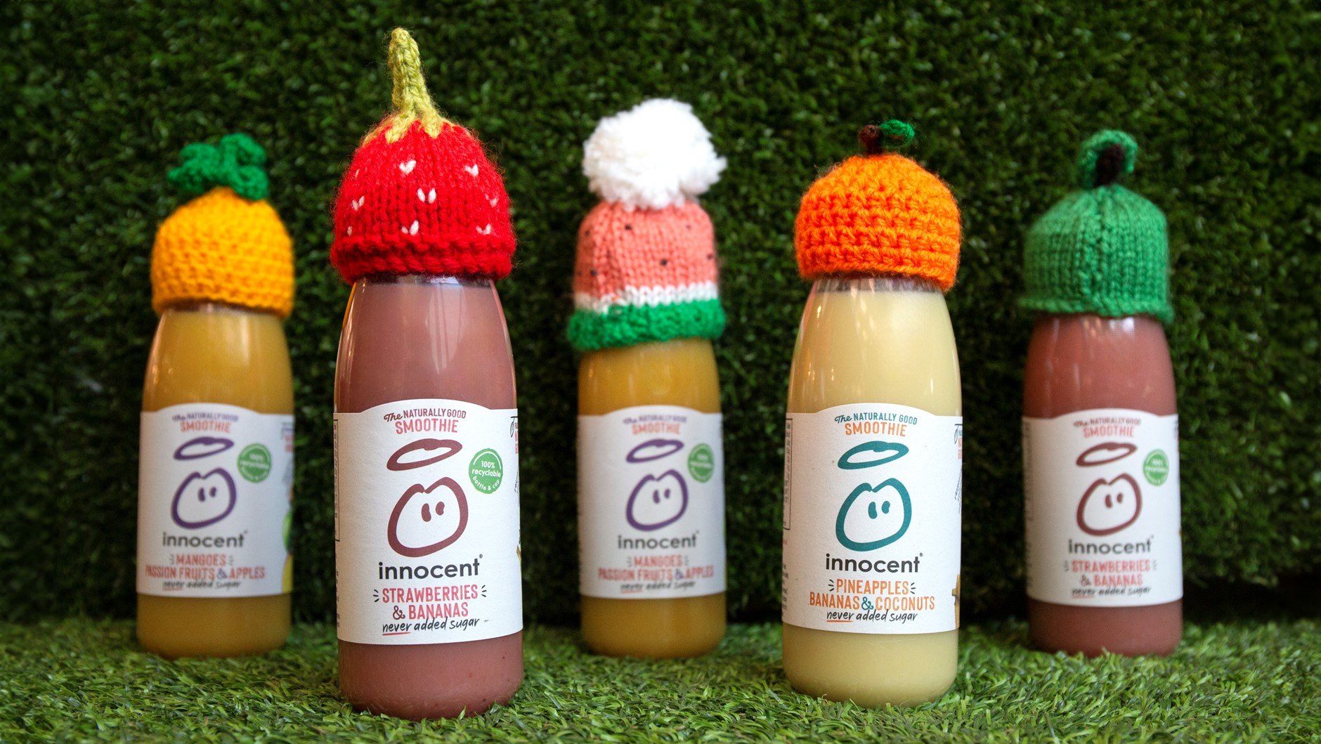 A line of innocent smoothies wearing little woolly hats