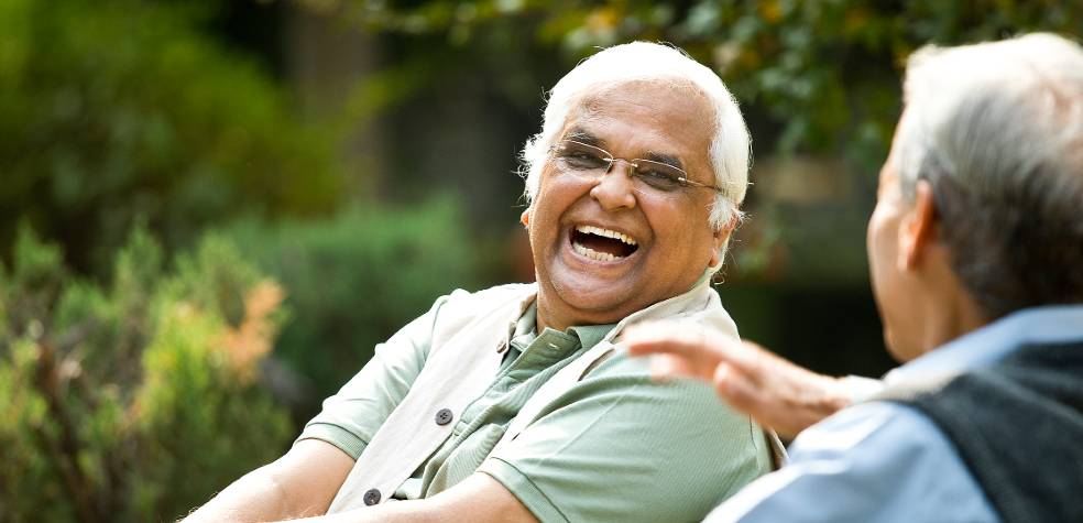 Laughing older man with friend 984x475.jpg